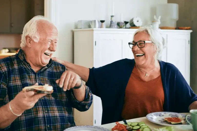 Happy Senior Couple Discussing tips for caring for Parkinson's Disease