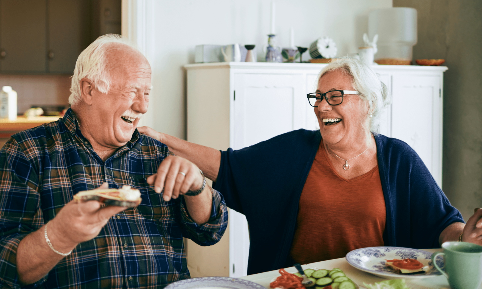 Happy Senior Couple Discussing tips for caring for Parkinson's Disease