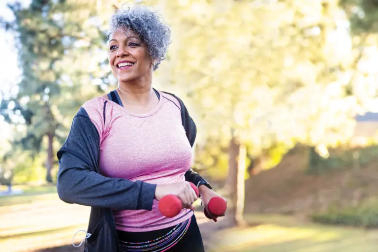 Image of a happy senior practicing easy and safe exercises to help prevent falls.