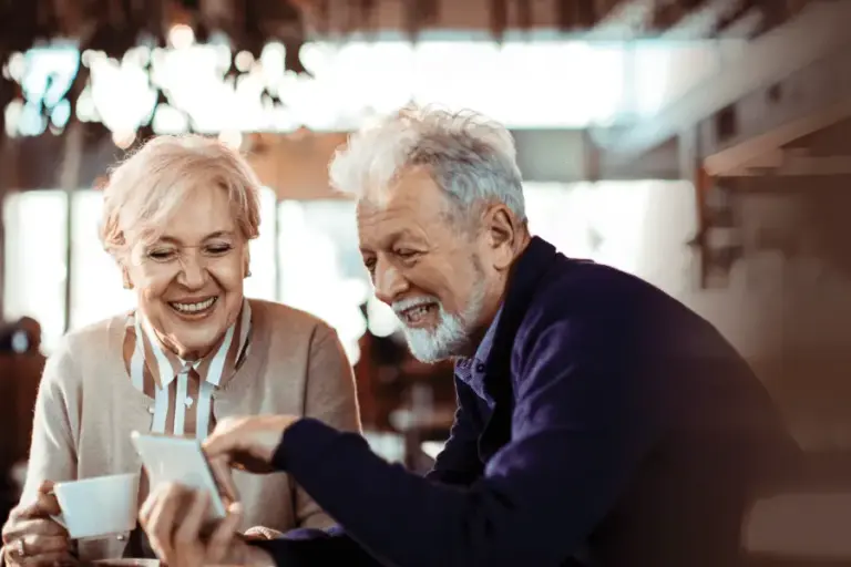 Image of happy seniors discussing the best technology for aging in place.