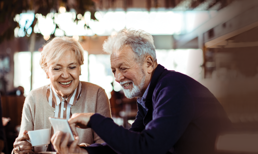 Image of happy seniors discussing the best technology for aging in place.