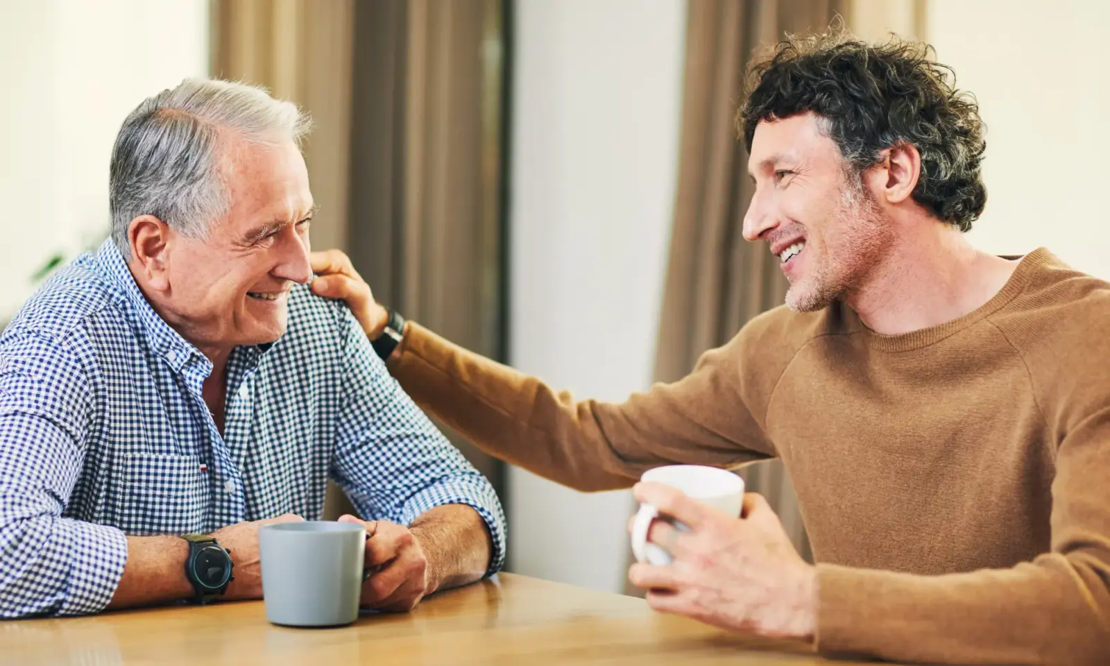 An older gentleman chats with his son about long term care planning.