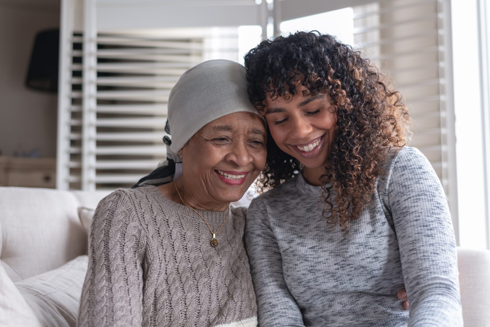 Senior woman with cancer sitting with her daughter