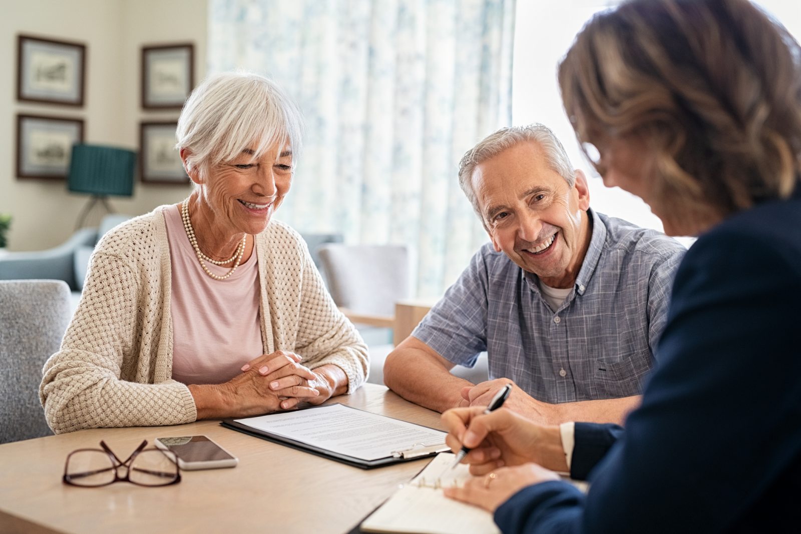 senior couple looking at home care insurance paperwork