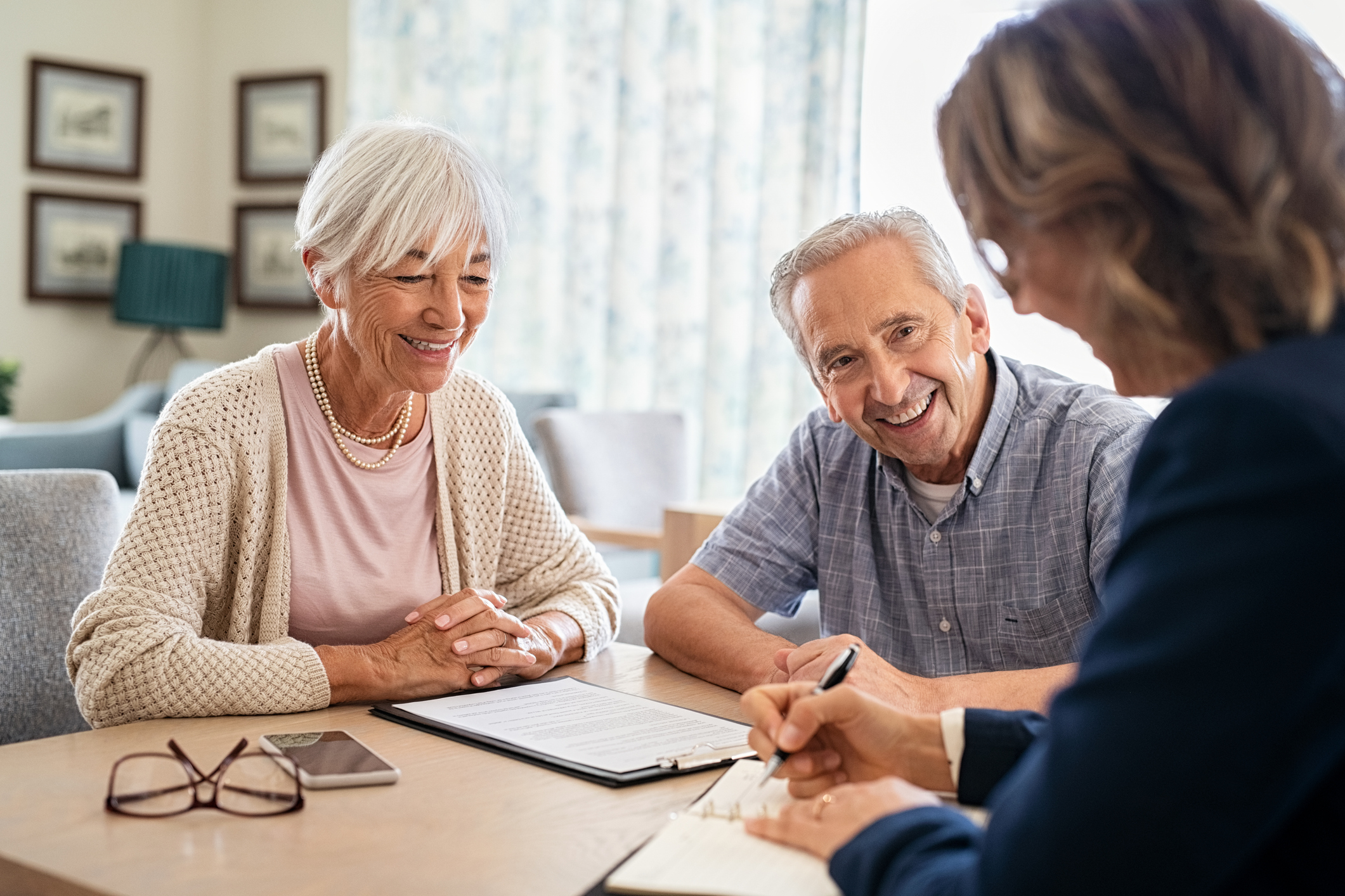 senior couple looking at home care insurance paperwork
