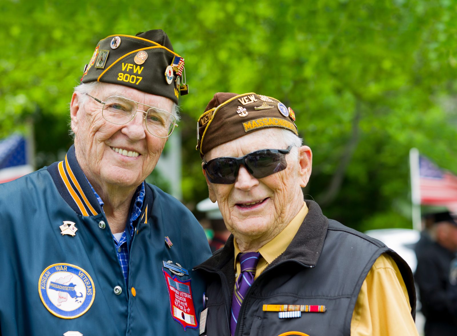Two senior veterans smiling, highlighting military benefits for family