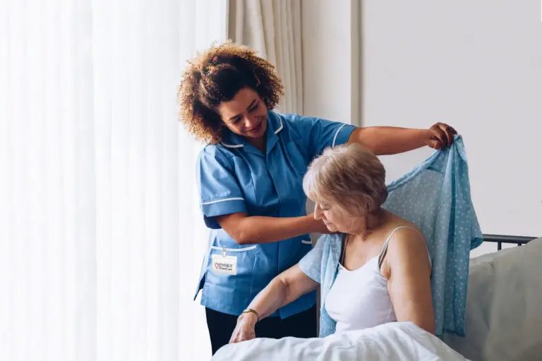 Happy caregiver and client sharing a moment at home