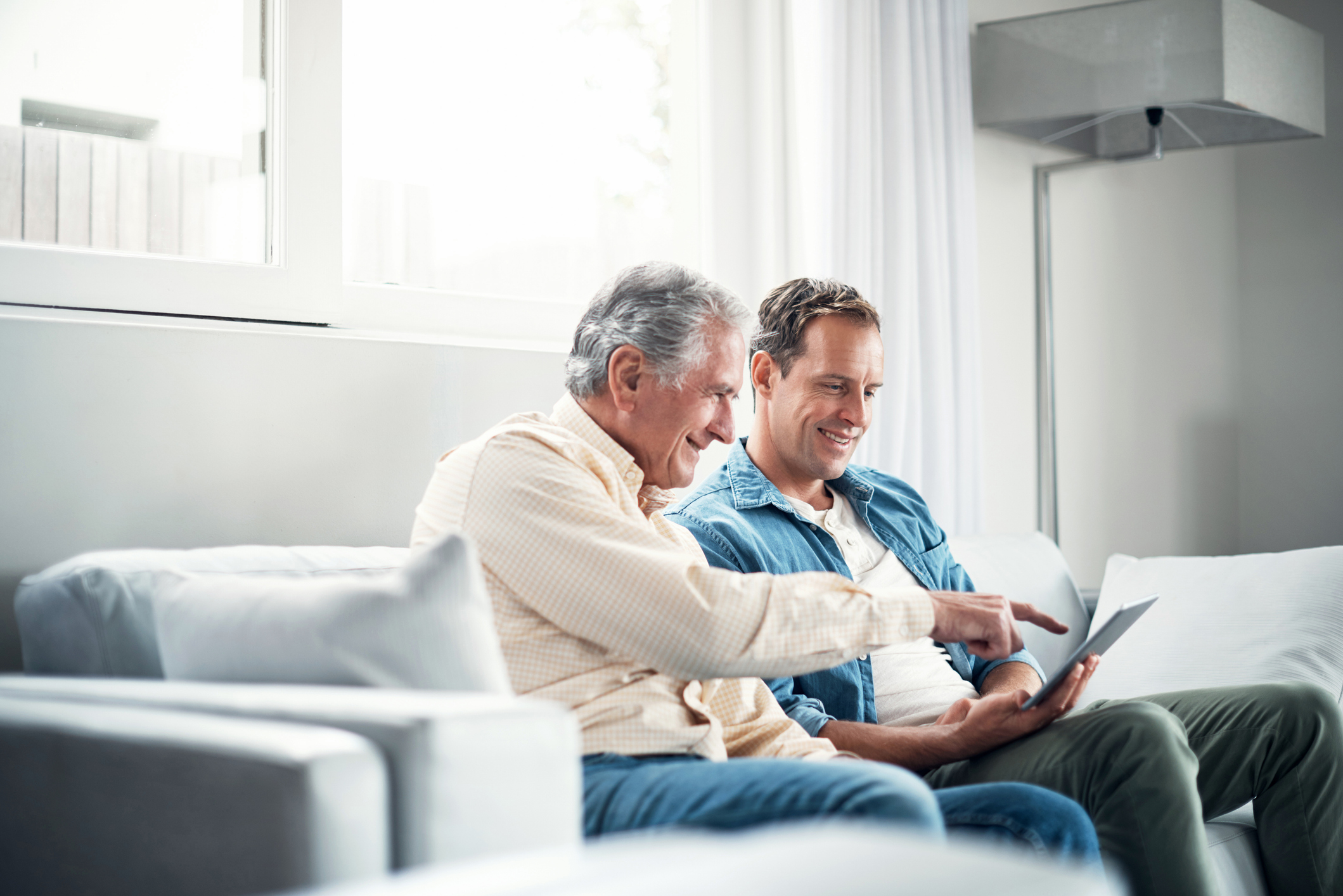 Son and father speaking about the cost of dementia care