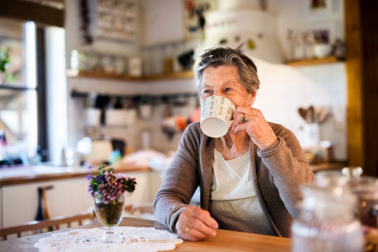 Grandmother at home drinking tea.