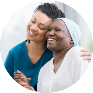 two women embracing each other and smiling 