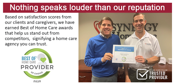 SYNERGY Homeare of Lowcountry owners holding award