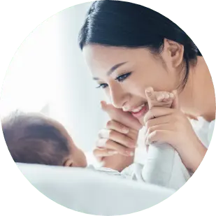 mother embracing her newborn baby