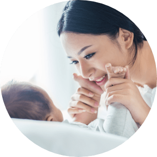 mother embracing her newborn baby