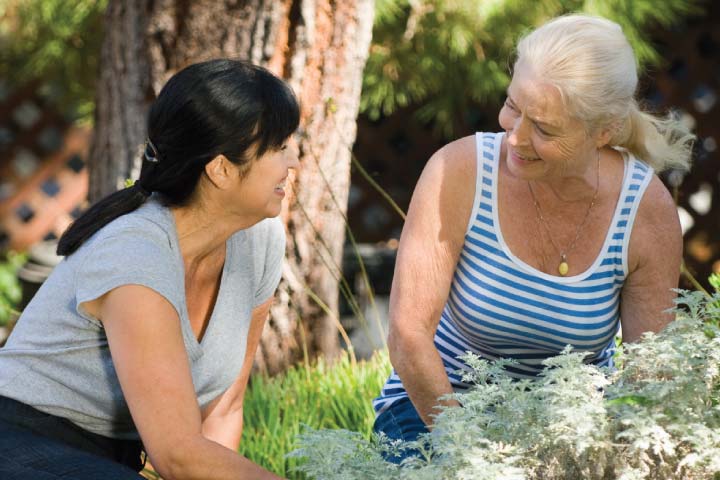 Older woman and friend gardening
