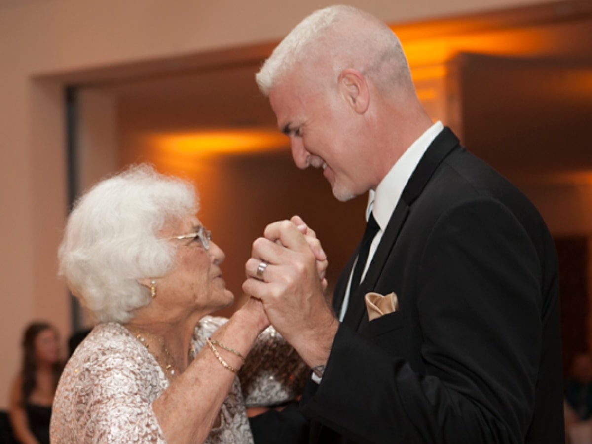 Photo of Kurt dancing at a wedding with his 90 year old mother