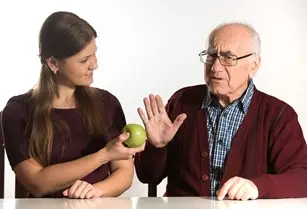 bigstock-young-woman-helps-senior-man-121214933