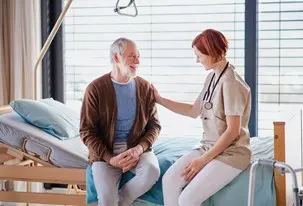 bigstock-a-female-doctor-talking-to-sen-350126770.jpg