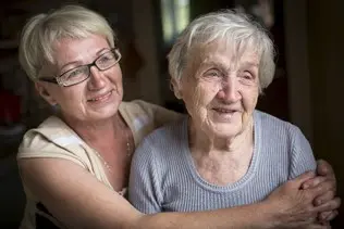 bigstock-an-elderly-woman-with-her-adul-131370128-2.jpg