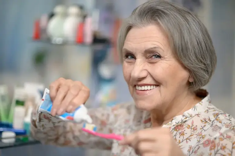 bigstock-beautiful-elderly-woman-brushi-58594103.jpg