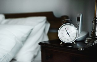 bigstock-bedroom-alarm-clock-224251606.jpg