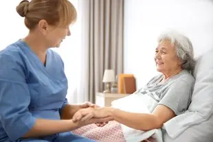 bigstock-caregiver-massaging-hand-of-se-221342581-1.jpg
