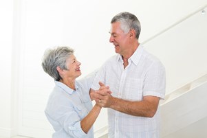 bigstock-cheerful-senior-couple-dancing-62613257.jpg