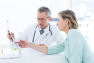 bigstock-doctor-having-conversation-wit-89051804.jpg