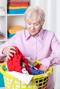 bigstock-elderly-woman-doing-laundry-64329436.jpg