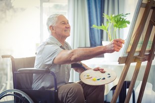 bigstock-happy-senior-man-painting-at-h-138319715-1.jpg