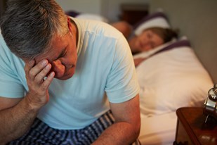 bigstock-man-awake-in-bed-suffering-wit-54834272.jpg