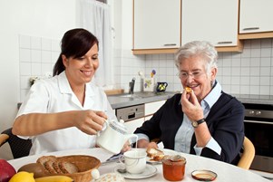 bigstock-nurse-helps-elderly-woman-at-b-25297304.jpg