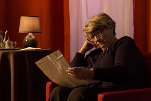 bigstock-senior-woman-reading-old-lette-85772198.jpg