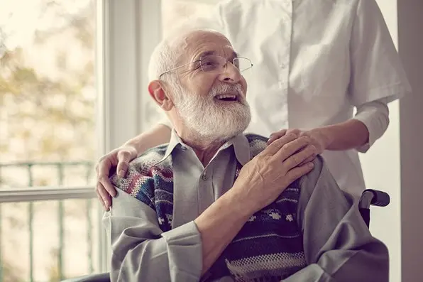 disabled man with caregiver