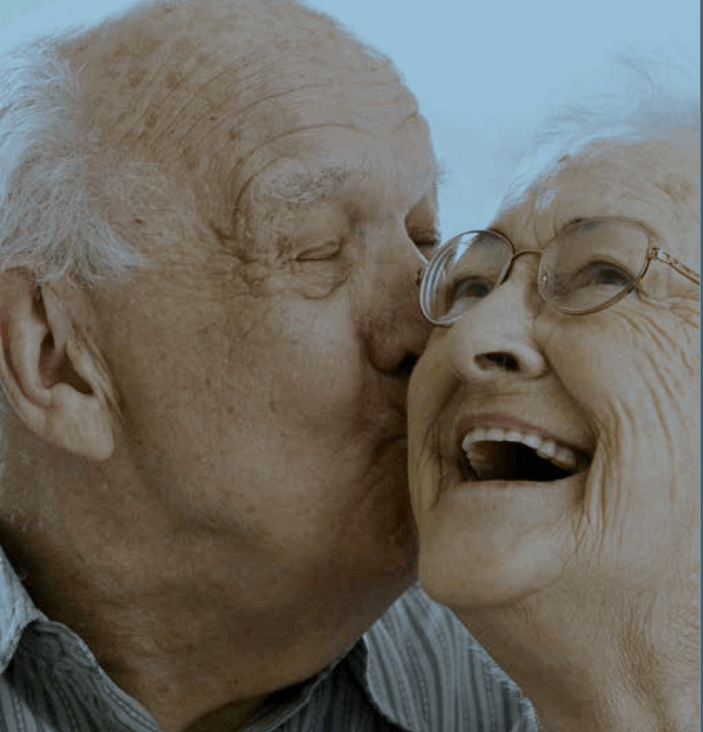 elderly-couple-head-shot-man-kissing-womans-cheek.png
