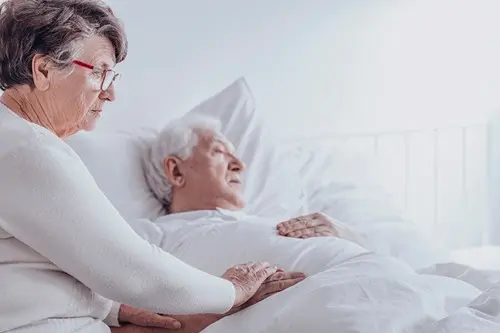 elderly wife with bedridden husband