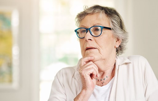 senior woman in glasses contemplating or thinking
