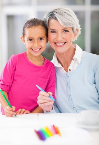 Grandma Coloring With Her Grandkids