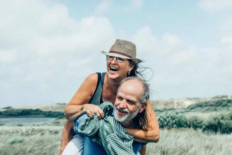 older-couple-playing-in-a-field.jpg
