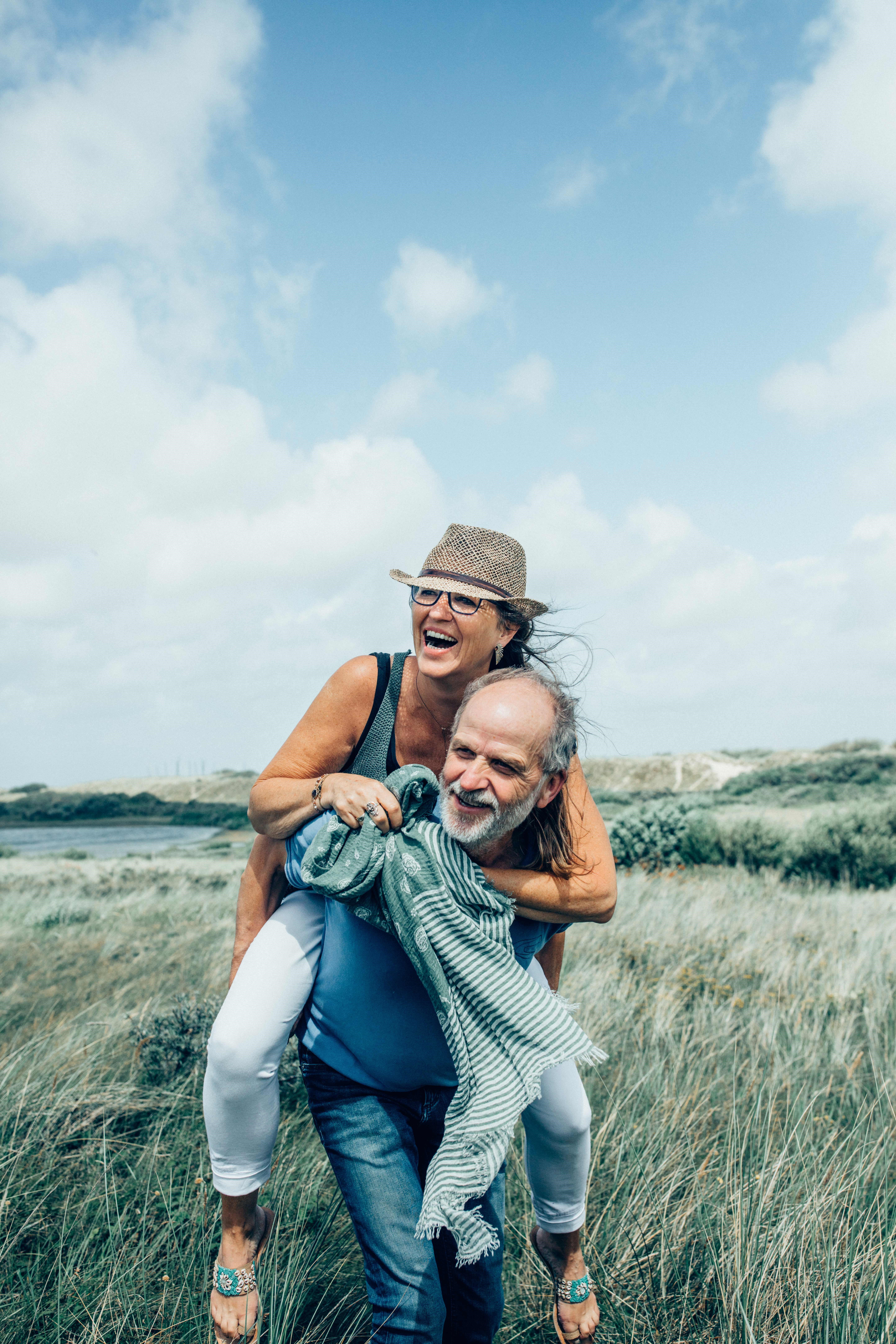 older-couple-playing-in-a-field.jpg