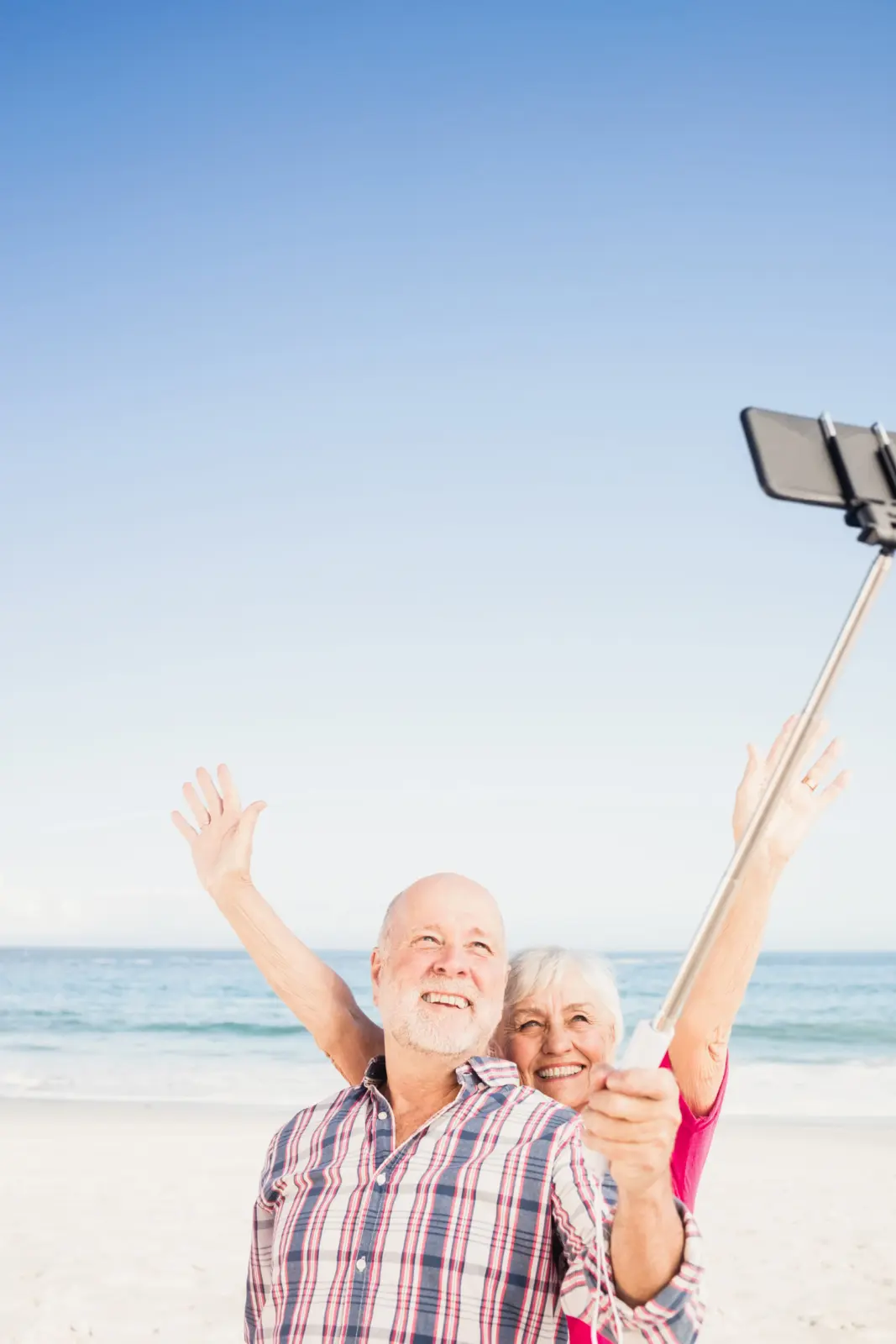 older-couple-taking-selfie-on-the-beach.jpg