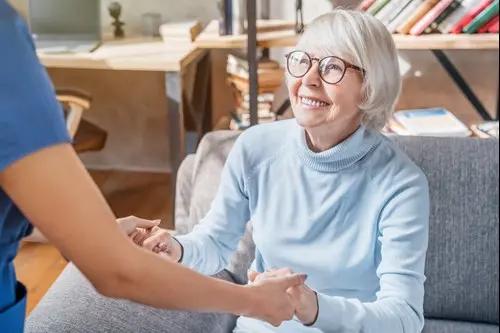 senior-woman-smiling-at-caregiver