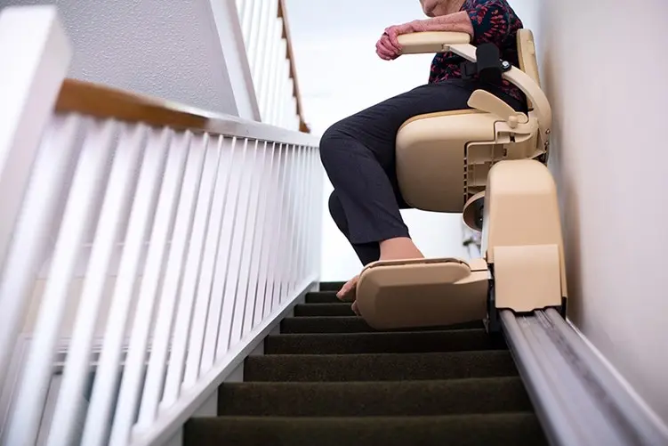senior riding stair chair upstairs
