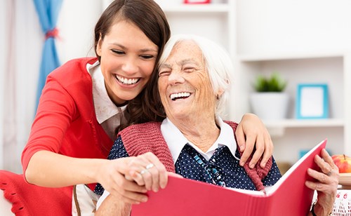 synergy-homecare-hispanic-caregiver-with-senior-client.jpg