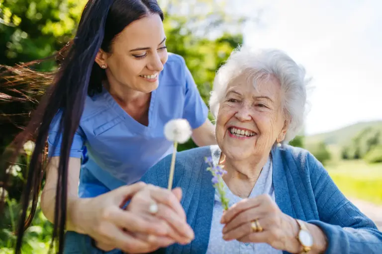 SYNERGY HomeCare caregiver and senior outside