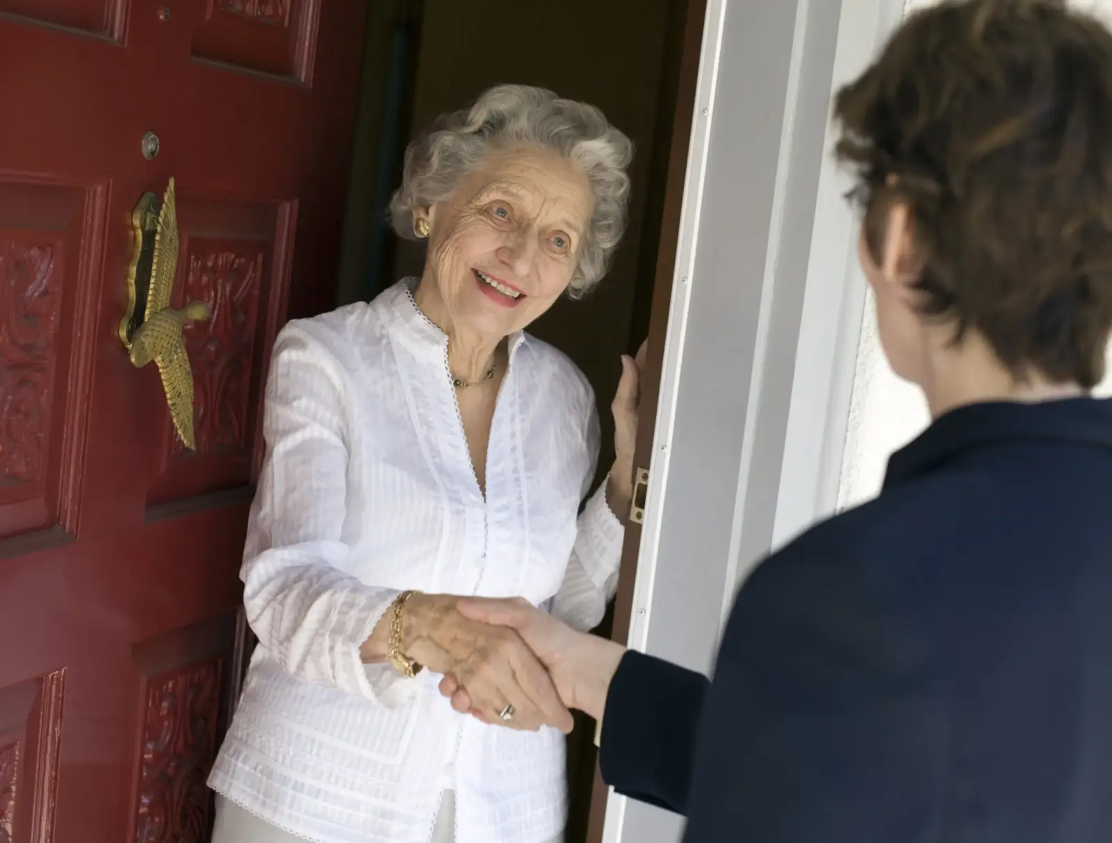 Senior woman friendly handshake