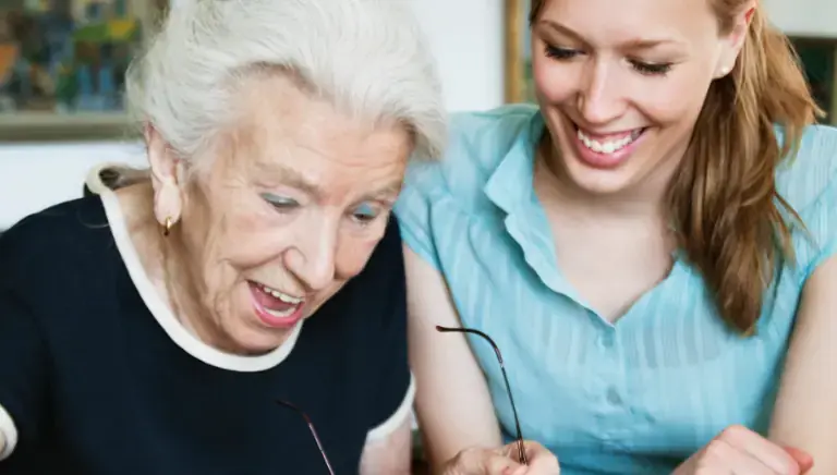 Compassionate caregiver helping a senior woman remain safe and independent at home in Tucson, Arizona