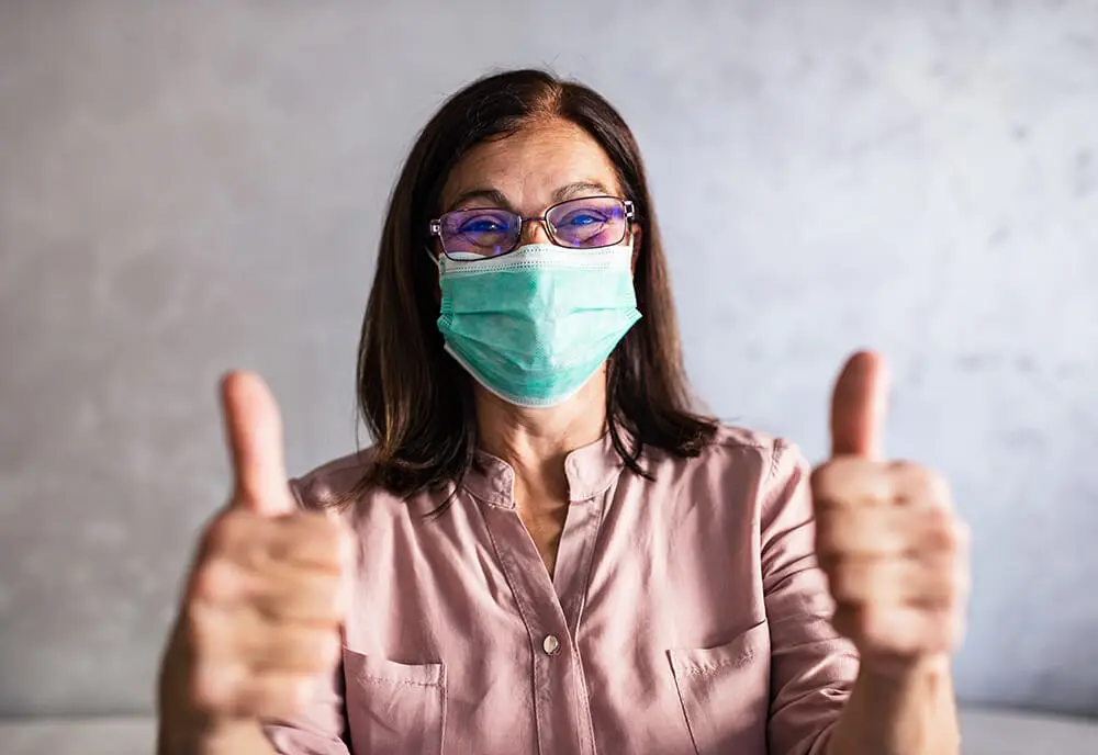 senior-woman-in-mask-two-thumbs-up-sm