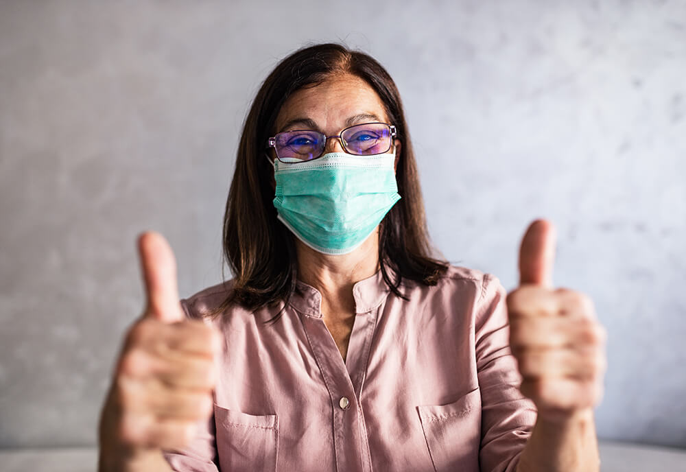 senior-woman-in-mask-two-thumbs-up-sm