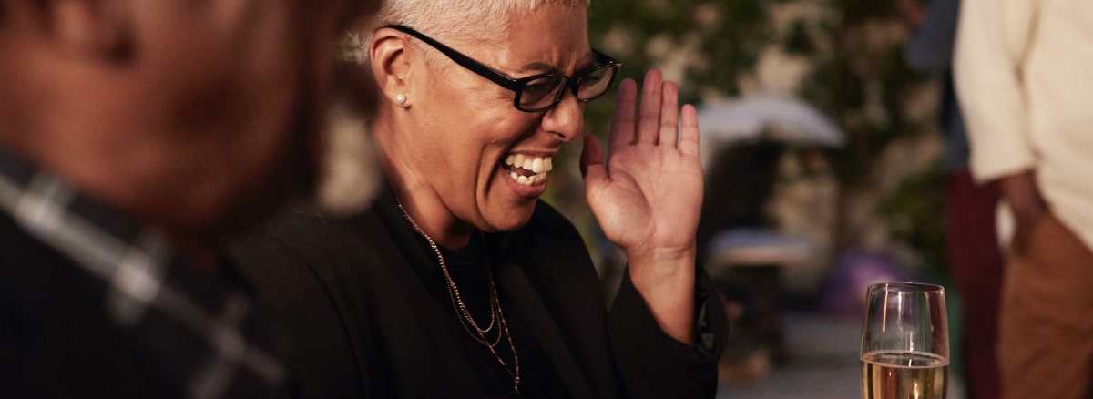 senior woman laughing and clapping